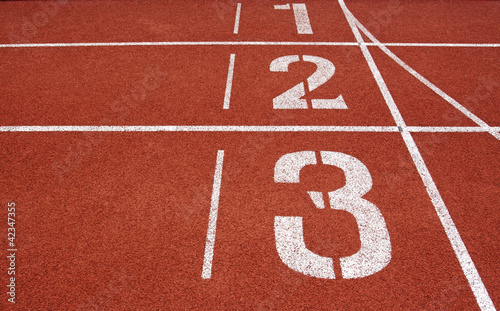 Photo: Running track numbers one two three in stadium Running track numbers one two three in stadium