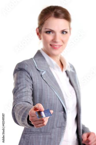 Photo: Young business woman stretching out hand with plastic card Young business woman stretching out hand with plastic card