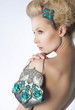 Fashion woman with jewelry and purse on white background