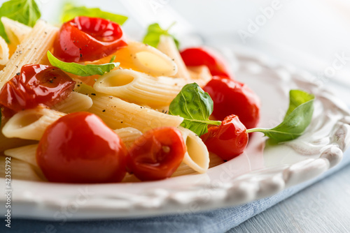 Photo: Penne pasta with cherry tomatoes and basil Penne pasta with cherry tomatoes and basil