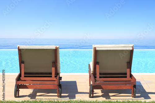 Photo: Luxury hotel swimming pool in front of the sea Luxury hotel swimming pool in front of the sea