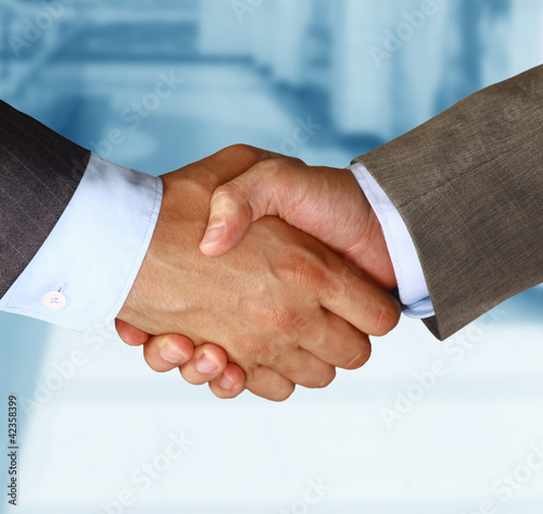 Photo: Two businessman shaking hands Two businessman shaking hands