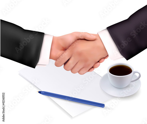 Vector: Handshake over paper and pen. Vector illustration. Handshake over paper and pen. Vector illustration.