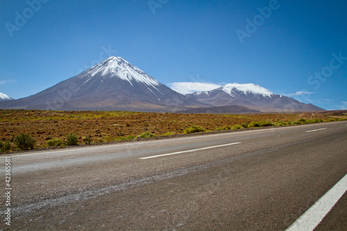 Photo: Heading out San Pedro de Atacama, a view of Volcano Licancabur. Heading out San Pedro de Atacama, a view of Volcano Licancabur.