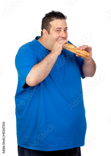 Foto: Happy fat man eating a large bread Happy fat man eating a large bread