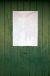 paper on weathered wood door