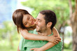 Foto: Happy girl embracing handsome male outside Happy girl embracing handsome male outside