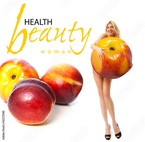 Photo: Portrait of a young woman with fruit. Concept Portrait of a young woman with fruit. Concept