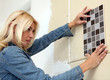 Young woman choose tiles