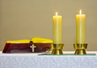 Bible Golden and two burning candles