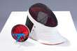fencers sword and mask on a white background