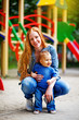 Ginger mother with baby