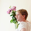 Young man gives his girlfriend flowers