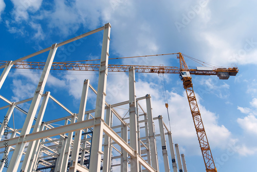 Photo: Construction of building a beautiful sky background Construction of building a beautiful sky background
