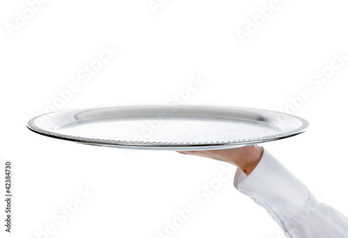 Photo: Waiter holding empty silver tray Waiter holding empty silver tray
