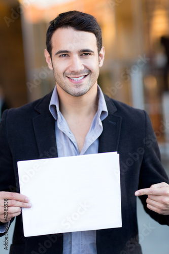 Foto: Businessman with a poster Businessman with a poster