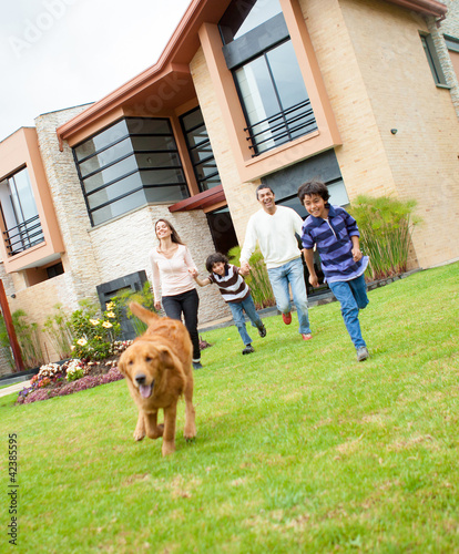 Photo: Family running with a dog Family running with a dog
