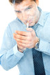 Young man lighting a cigarette