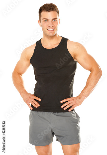 Photo: Healthy muscular young man isolated on white Healthy muscular young man isolated on white
