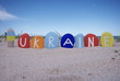 Photo: Ukraine with national flag on colourful stones Ukraine with national flag on colourful stones