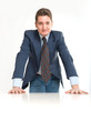 Foto: Businessman leaning on a white desk Businessman leaning on a white desk