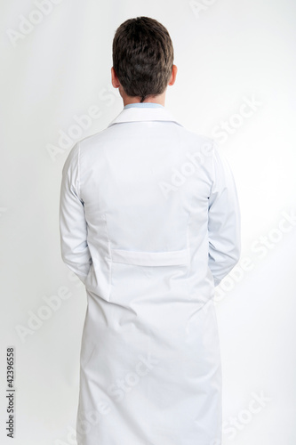 Photo: Rear view of a man on lab coat Rear view of a man on lab coat