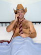 businessman with the phone in bed..