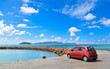 car on tropical beach