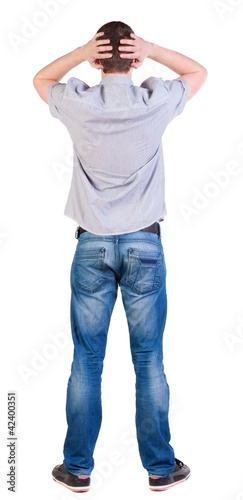 Photo: Back view of shocked man in shir Back view of shocked man in shir