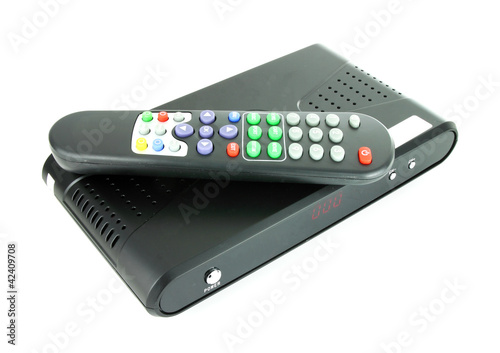 Photo: remote and receiver for satellite TV on white remote and receiver for satellite TV on white