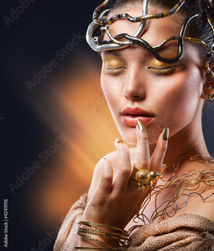 Photo: Golden Makeup. Fashion Girl Portrait Golden Makeup. Fashion Girl Portrait