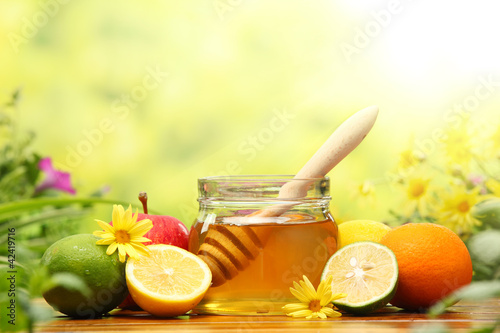 Photo: Honey and fresh fruits Honey and fresh fruits
