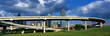 Photo: This is a freeway overpass with the Dallas skyline visible behind it. The freeway curves and snakes around in a circle in front of the city. This is a freeway overpass with the Dallas skyline visible behind it. The freeway curves and snakes around in a circle in front of the city.