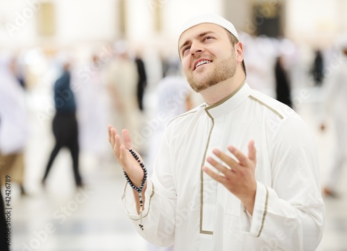 Photo: Muslim praying at Medina mosque Muslim praying at Medina mosque
