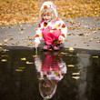 Child playing in puddle