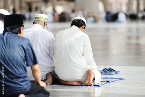 Photo: Muslims praying together at Holy mosque Muslims praying together at Holy mosque