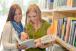 Photo: Girl friends student at high school library Girl friends student at high school library