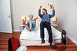 couple in a hotel room with new red shoes