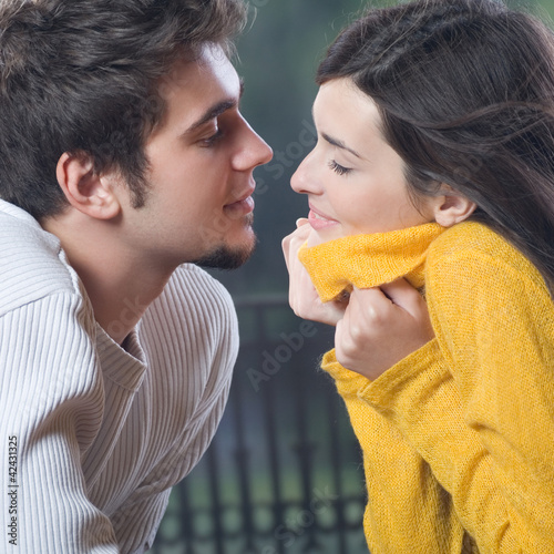 Photo: Happy smiling cheerful couple outdoors Happy smiling cheerful couple outdoors