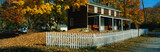Photo: This is a brown, wooden house in a historic village near the Delaware River. A white picket fence surrounds the house. There are autumn leaves on the trees surrounding the property. This is a brown, wooden house in a historic village near the Delaware River. A white picket fence surrounds the house. There are autumn leaves on the trees surrounding the property.