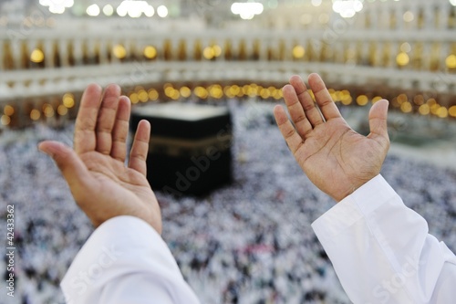Photo: Muslim praying at Mekkah with hands up Muslim praying at Mekkah with hands up