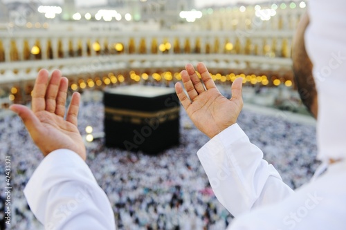 Photo: Muslim praying at Mekkah with hands up Muslim praying at Mekkah with hands up