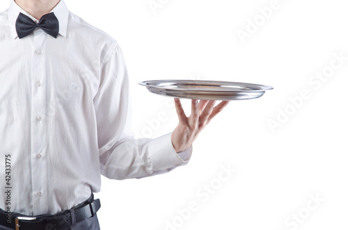 Foto: Young waiter with silver tray Young waiter with silver tray