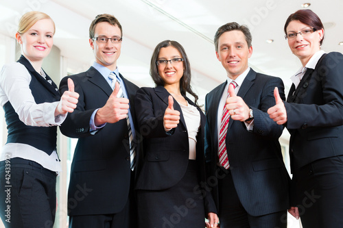 Photo: Business - group of businesspeople in office Business - group of businesspeople in office