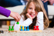 Foto: Family playing board game at home Family playing board game at home