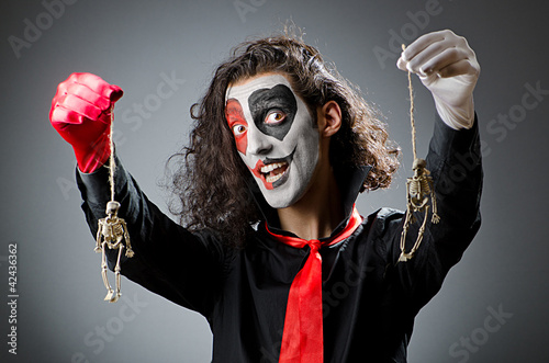 Photo: Joker with face mask in studio Joker with face mask in studio