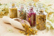 healing herbs in glass bottles, herbal medicine