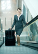 Business woman with luggage