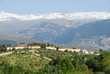 Photo: The Sierra Nevada seen Alhambra palace in Granada (Spain). The Sierra Nevada seen Alhambra palace in Granada (Spain).