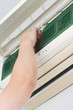 Foto: Fitting a clean filter into an air-conditioner Fitting a clean filter into an air-conditioner